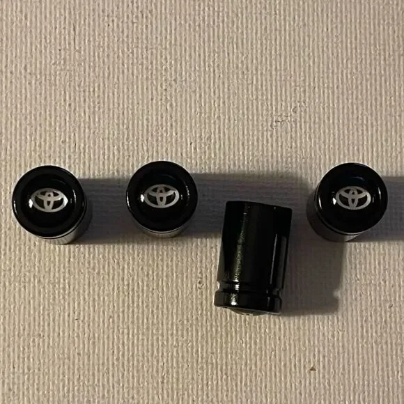 Toyota Logo valve Stem caps in black set of 4 NWT - Picture 1 of 4